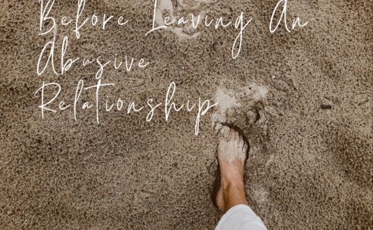 Two feet standing on sandy ground with text overlay: "Steps to Take Before Leaving an Abusive Relationship".