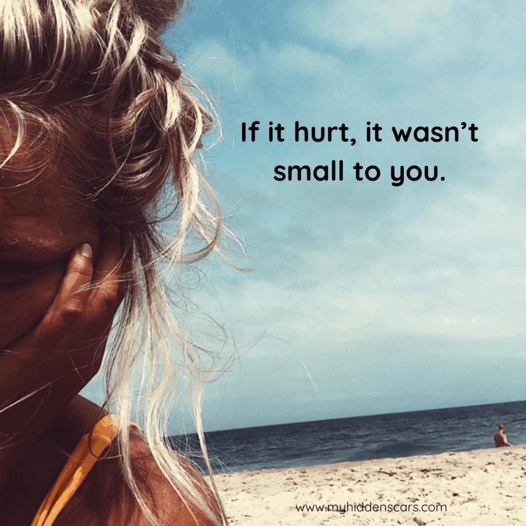 A woman sits on a beach holding her face, with the text "If it hurt, it wasn't small to you." The sky is partly cloudy, and the ocean is in the background—reflecting on needs vs expectations in relationships.